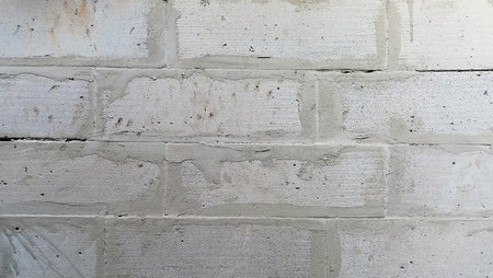 The texture of the cement brick wall is not finished yet