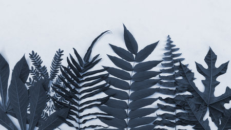 Monochrome blue botanical leaf composition