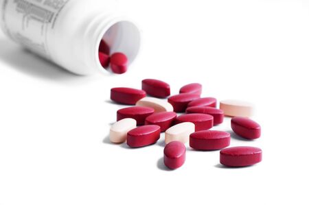 red and orange vitamins pillsの写真素材