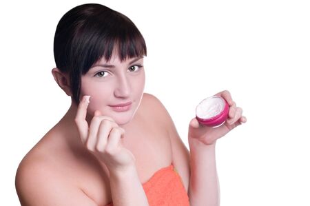 beatifull woman with cream on faceの写真素材