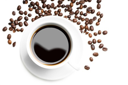 cup of coffee with coffee grains isolated on whiteの写真素材