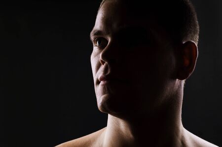 Man s portrait on black background  Close-up faceの写真素材