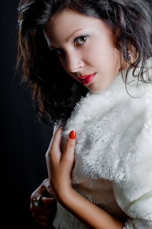 beautiful sexy girl in fur coatの写真素材