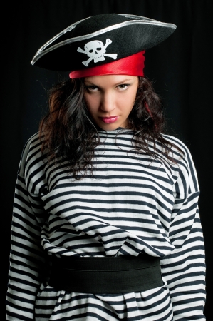 Young woman dressed as a pirate in a black hatの写真素材