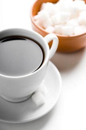 Cup of coffee and plate with sugarの写真素材