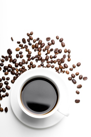 cup of coffee with coffee grains isolated on whiteの写真素材