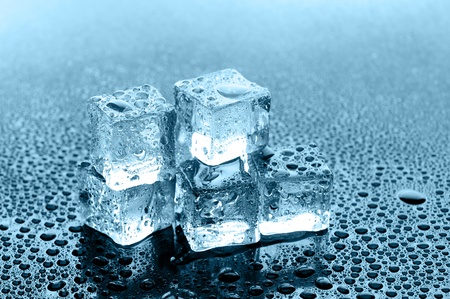 wet ice cubes on black glossy backgroundの写真素材