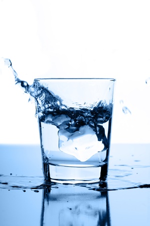 water splash in glass with iceの写真素材