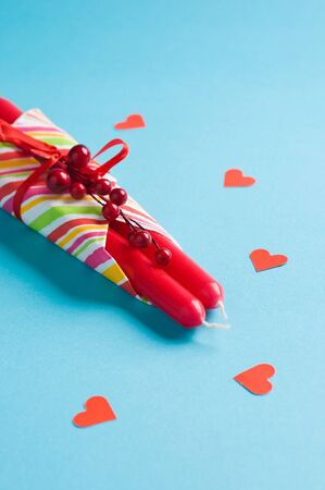 red candles and hearts on blueの写真素材