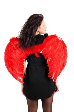 Beautiful girl with red angel wings isolated on whiteの写真素材