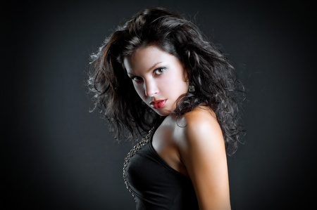 art fashion photo of portrait young woman on dark backgroundの写真素材