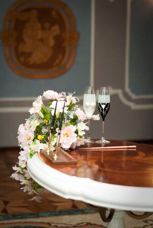 beautifully decorated wedding glasses with champaignの写真素材