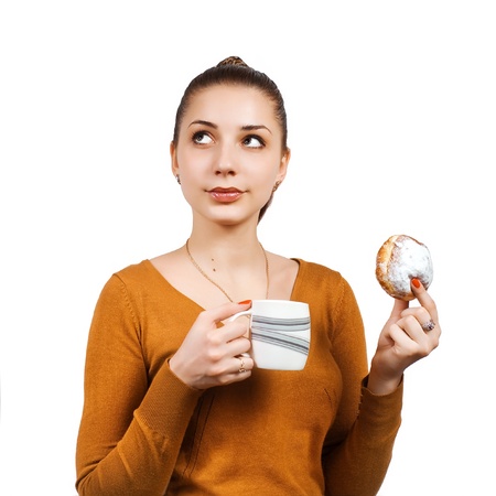 Portrait of pretty young woman with cake and milkの写真素材
