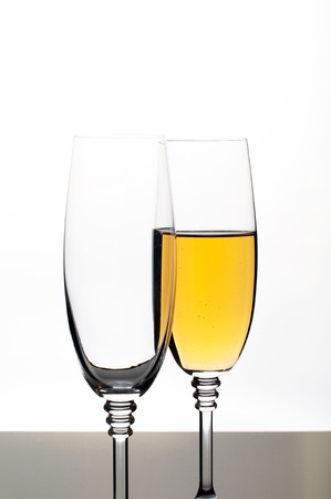 Two glasses of champagne or wine isolated on whiteの写真素材