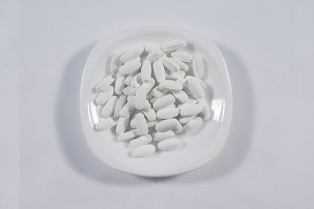Pharmacy theme, white medicine tablets antibiotic pills.の写真素材