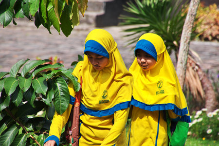 Padang, Indonesia - 30 Jul 2016. Some schoolchild on a tour in the temple close Padang, Indonesiaのeditorial素材