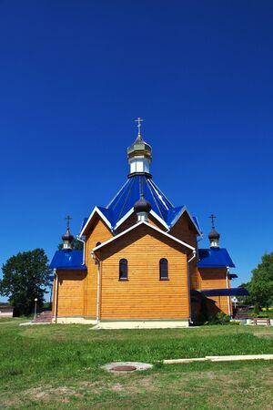 The wooden church in Kamenyuki village, Belarusの写真素材