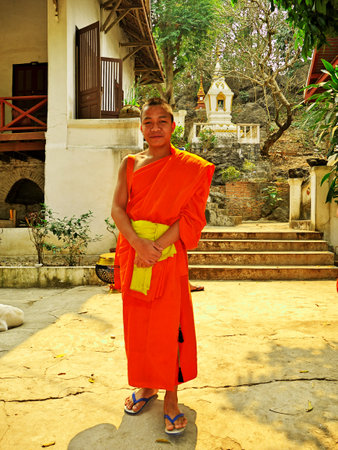 Luang Prabang / Laos - 25 Feb 2012: The monk in the ancient Wat in Luang Prabang, Laosのeditorial素材