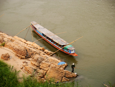 Luang Prabang / Laos - 25 Feb 2012: The boat on Mekong river in Luang Prabang, Laosのeditorial素材