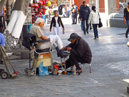 Puebla / Mexico - 02 Mar 2011: The shoe cleaner, Puebla, Mexico