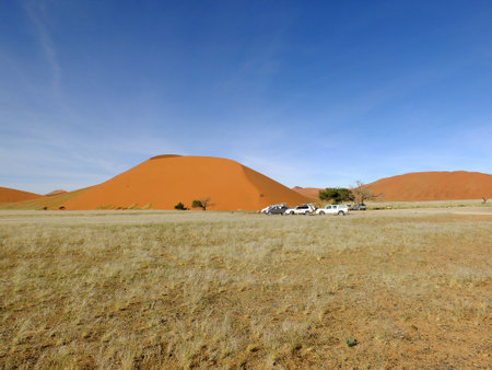 Sossusvlei / Namibia - 02 May 2012: Cars in dunes in Namib desert, Sossusvlei, Namibiaのeditorial素材