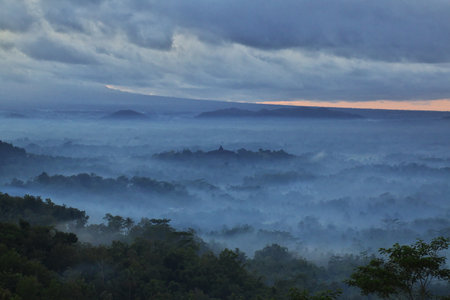 Borobudur / Indonesia - 02 Aug 2016: The blue fog during sunrise on Borobudur temple, Indonesiaのeditorial素材