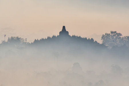 Borobudur / Indonesia - 02 Aug 2016: The blue fog during sunrise on Borobudur temple, Indonesiaのeditorial素材