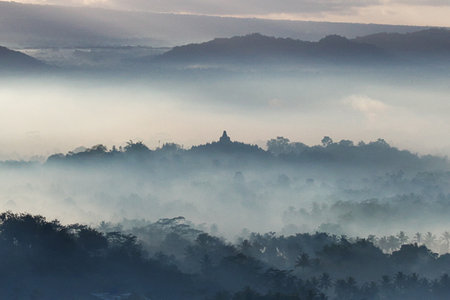 Borobudur / Indonesia - 02 Aug 2016: The blue fog during sunrise on Borobudur temple, Indonesiaのeditorial素材