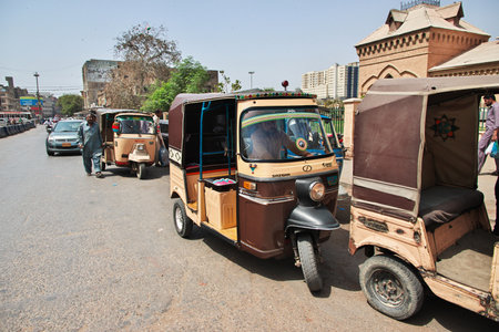 Karachi, Pakistan - 21 Mar 2021: The taxi Tuk tuk in Karachi, Pakistan