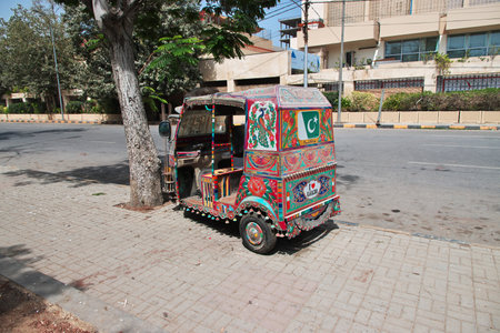 Karachi, Pakistan - 21 Mar 2021: The taxi Tuk tuk in Karachi, Pakistanのeditorial素材
