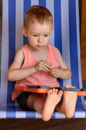 The child is passionate about childrens games.の写真素材