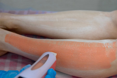 The wax heater leaves pink stripes on the skin of the legs.の写真素材