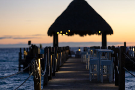 An open-air cafe with a view of the sunset and the Caribbean Sea.の写真素材