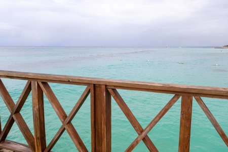 View from the pier to the beautiful sea and the sandy Caribbean coast