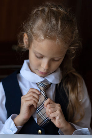 Portrait of a girl going to school.Young student in school uniformの写真素材