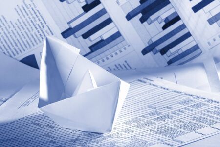 Business concept, paper boat and documents