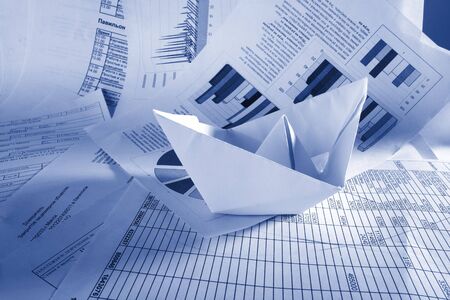 Business concept, paper boat and documentsの写真素材