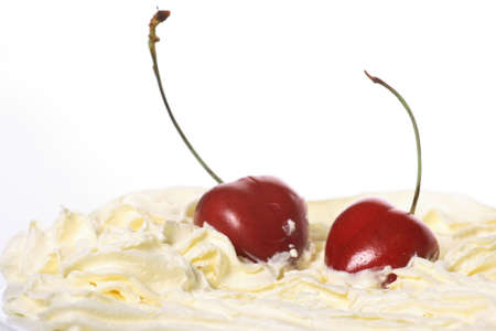 cream, cherries on a white backgroundの写真素材
