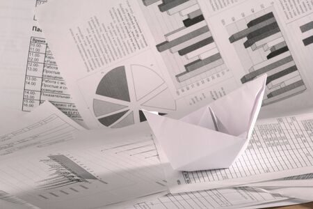 Business concept, paper boat and documentsの写真素材