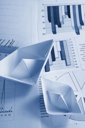 Business concept, paper boat and documentsの写真素材