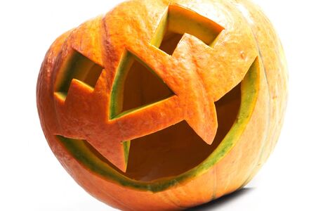 Creepy carved pumpkin face, with a smileの写真素材