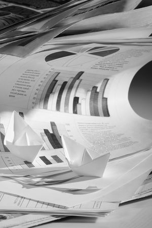 Business concept, paper boat and tsunami documentsの写真素材