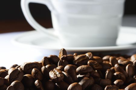 Cup with coffee, costing on coffee grainの写真素材