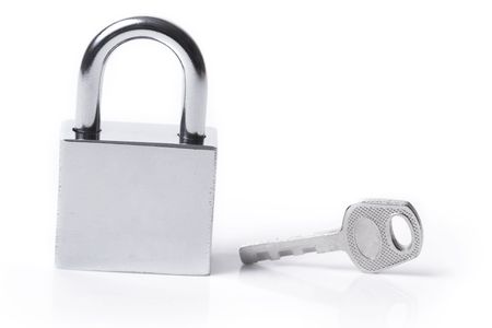 Lock and key on the white backgroundの写真素材