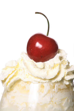 cream, cherries on a white backgroundの写真素材