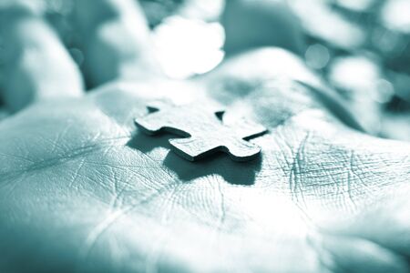 The hand holds puzzle on a background