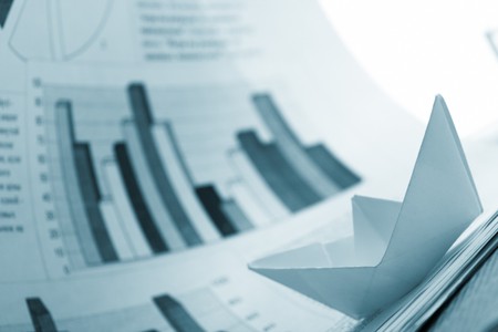 Business concept, paper boat and tsunami documentsの写真素材