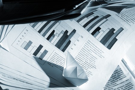 Business concept, paper boat and tsunami documentsの写真素材