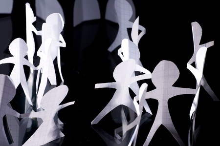 Crowd of paper people keeping for handsの写真素材