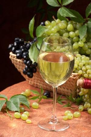 White dry wine, fresh clusters of a grapesの写真素材